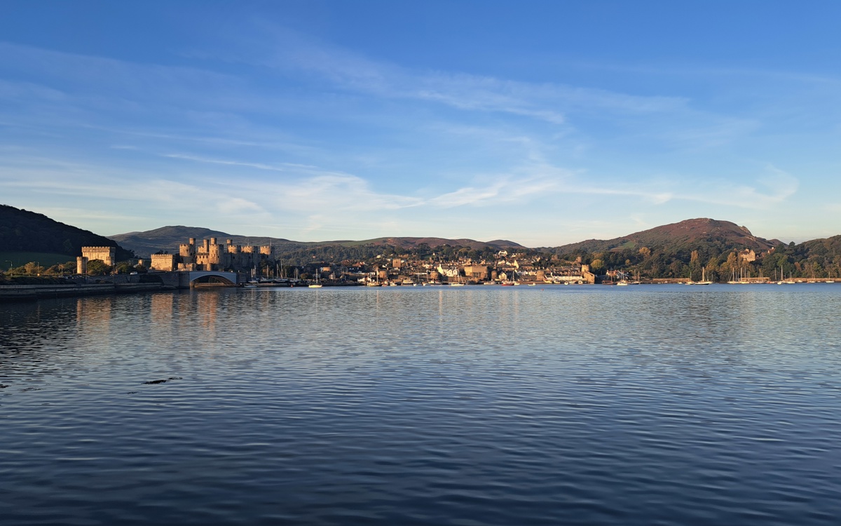 A coastal photograph of Conwy with the castle in view. 