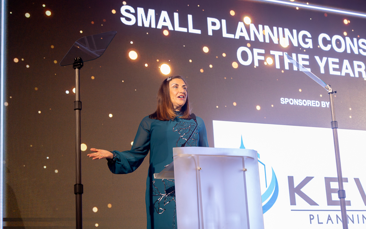 KEW Planning sponsor presenting on stage at the Awards for Planning Excellence 2025