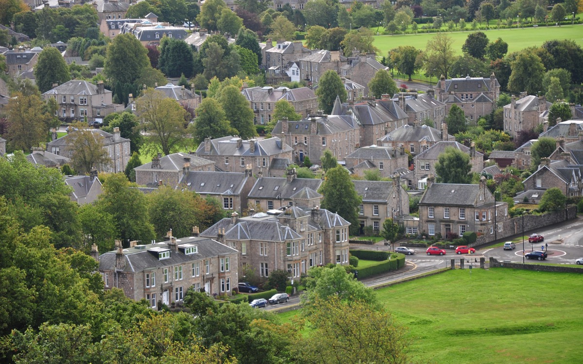 A photograph of houses in Stirling amongst greenery.